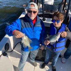 Lake Conroe Fishing Adventures Customers Holds Crappie Fish on Lake Conroe