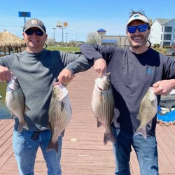 Lake Conroe Fishing Adventures Customers Holds Hybrid Striped Bass on Lake Conroe