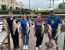 Lake Conroe Fishing Adventures Customers Hold Hybrid Striped Bass on Lake Conroe