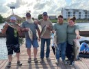 Lake Conroe Fishing Adventures Customers Hold Hybrid Striped Bass on Lake Conroe