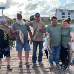 Lake Conroe Fishing Adventures Customers Hold Hybrid Striped Bass on Lake Conroe