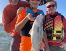 Lake Conroe Fishing Adventures Customers Hold Hybrid Striped Bass on Lake Conroe