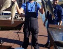 Collin Edwards Licensed Professional Fishing Guide on Lake Conroe Holds Hybrid Striped Bass