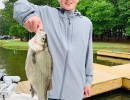 Lake Conroe Fishing Adventures Customer Holds Hybrid Striped Bass