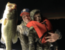 Lake Conroe Fishing Adventures Customers Hold Trophy Large Mouth Bass on Lake Conroe