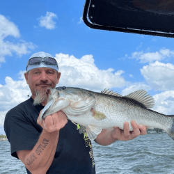 Lake Conroe Fishing Adventures Customer Holds Trophy Large Mouth Bass on Lake Conroe
