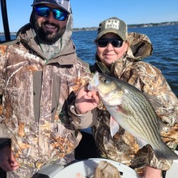Collin Edwards Licensed Professional Fishing Guide on Lake Conroe Holds Hybrid Striped Bass